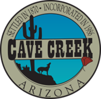 Town of Cave Creek logo, circular with blue sky background, cactus, and howling coyote.